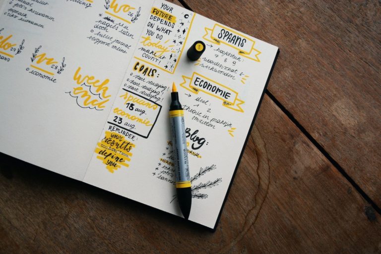Ruler and pen used to draw line in notebook
