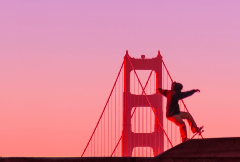 Skateboarder by Golden Gate Bridge