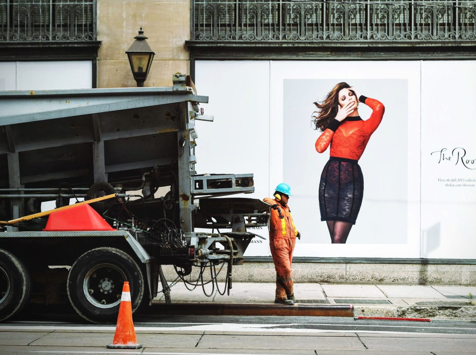 Construction worker in front of a branded display