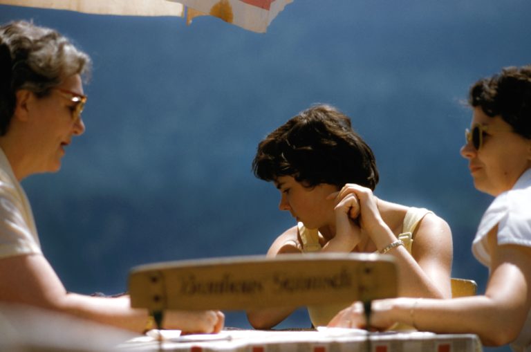 Three generations of women at a table