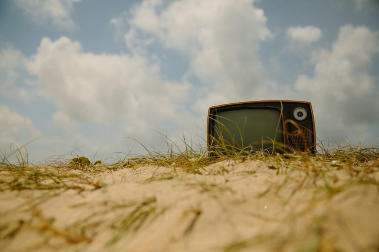 Retro TV on a sand dune