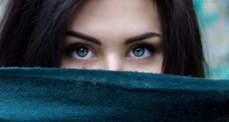 Woman's face partially covered