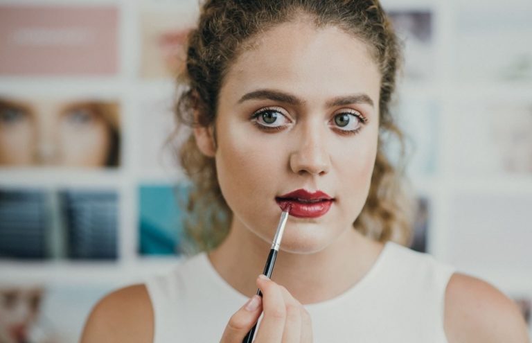 Woman applying makeup