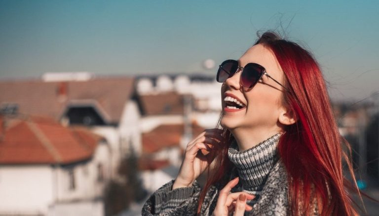 Woman laughing on rooftop