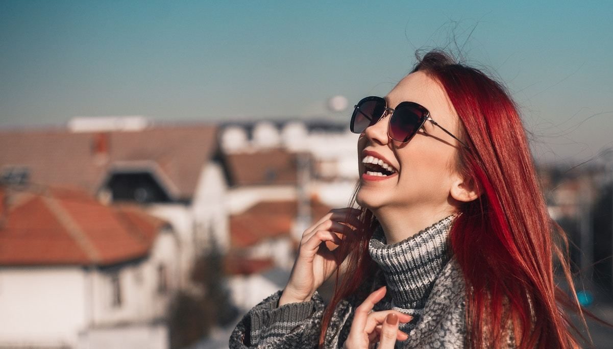 Woman laughing on rooftop