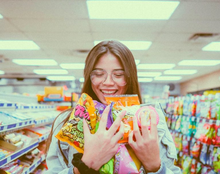 Woman with candy in store
