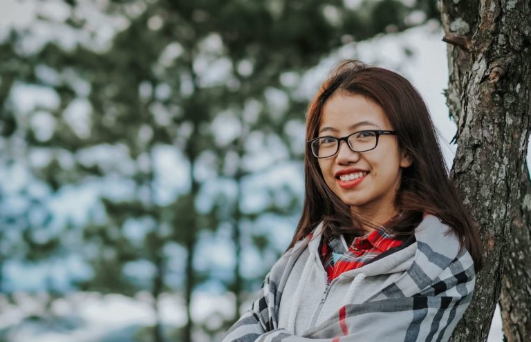 Woman smiling outdoors