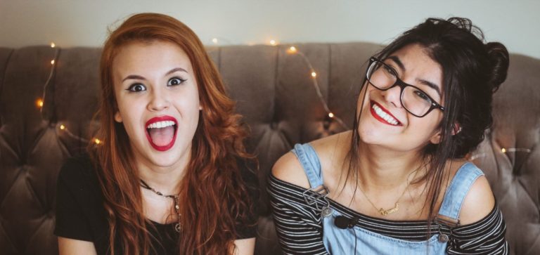 Two teenagers mugging for the camera