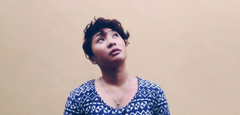 Woman looks up questioningly
