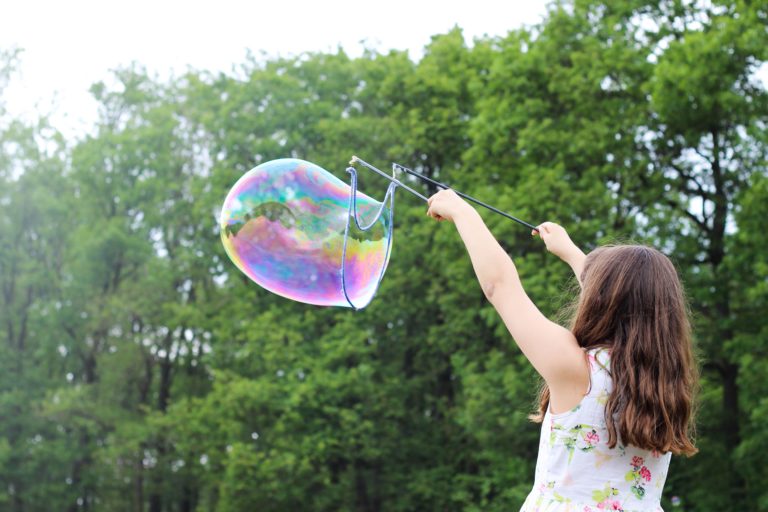 Girl making bubbles