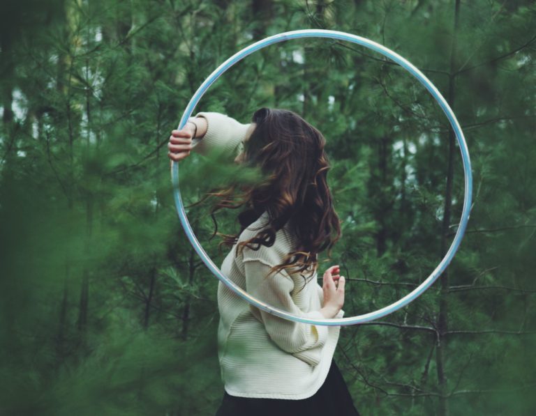 Girl with hoop in nature