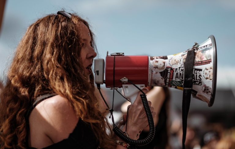 Woman speaking into a megaphone
