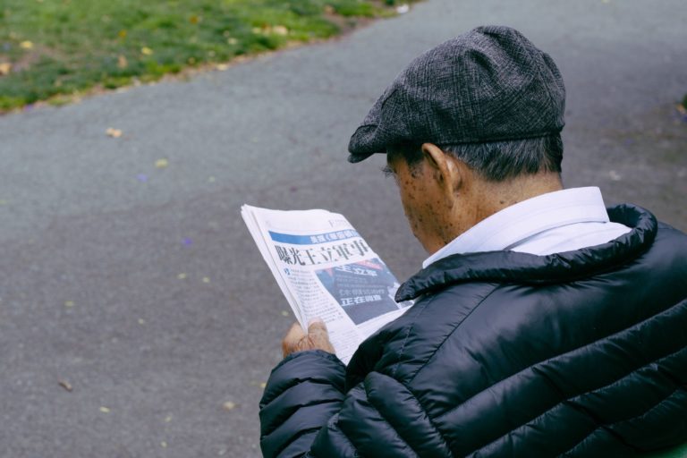 Man reading newspaper