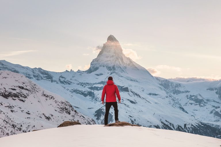 man views mountain in distance