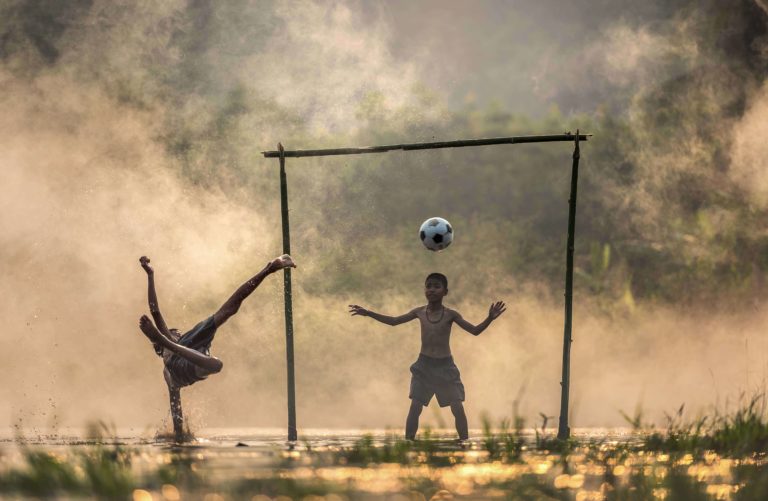 A child scores an impressive soccer goal