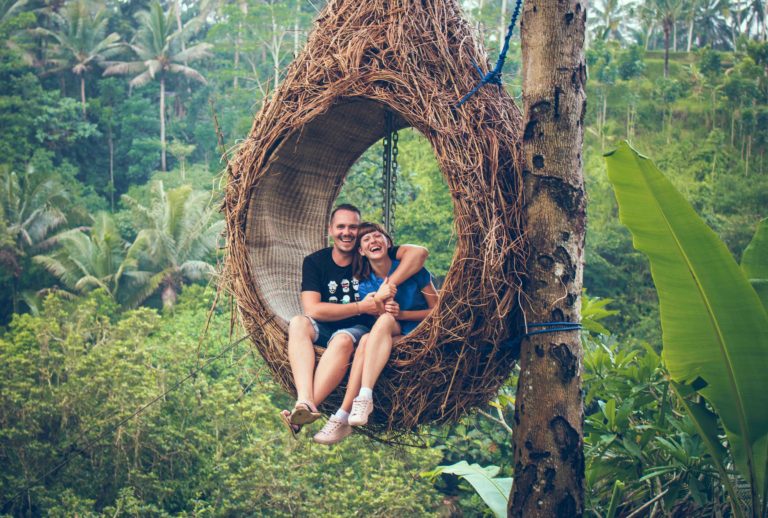 Couple in bird swing nest