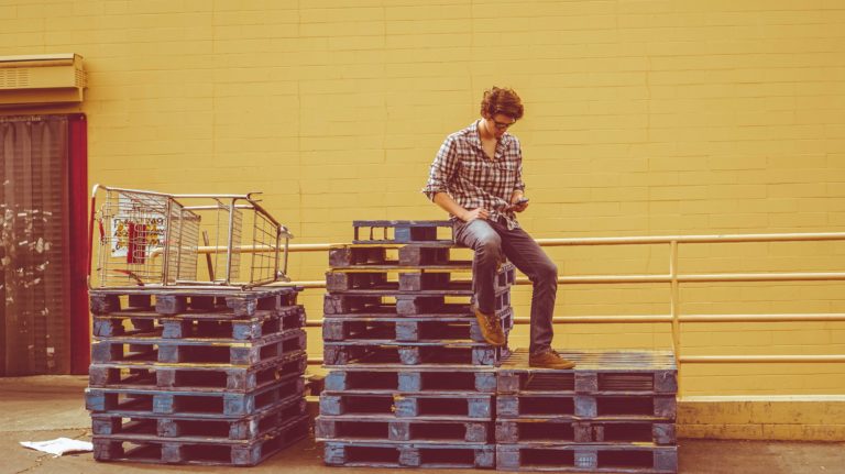 Man sitting on stacks