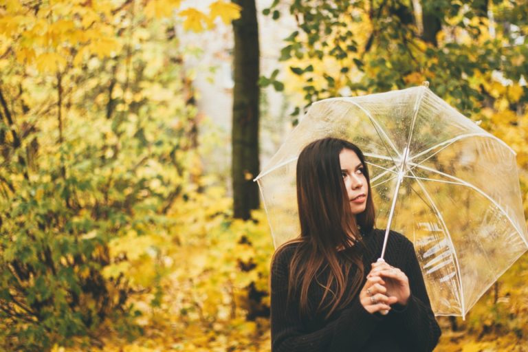 Fall woman with umbrella