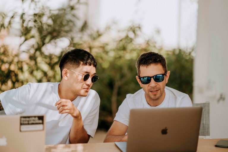 Two men on laptops