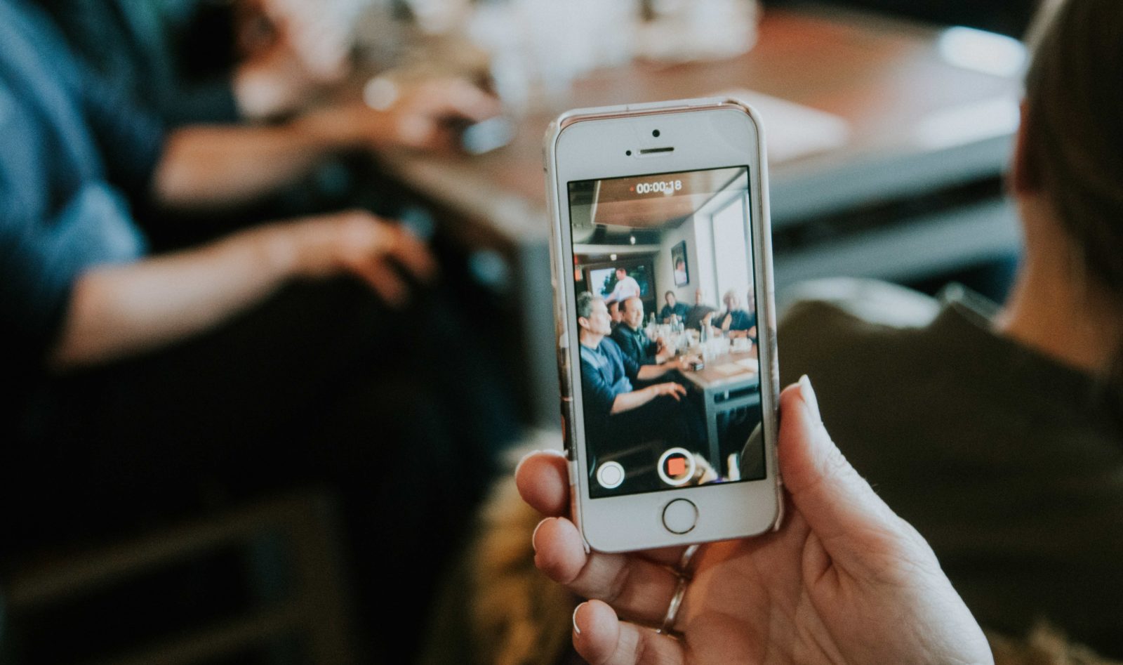 Person filming video on phone
