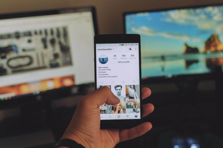 A man scrolls through his Instagram feed with an Android smartphone.