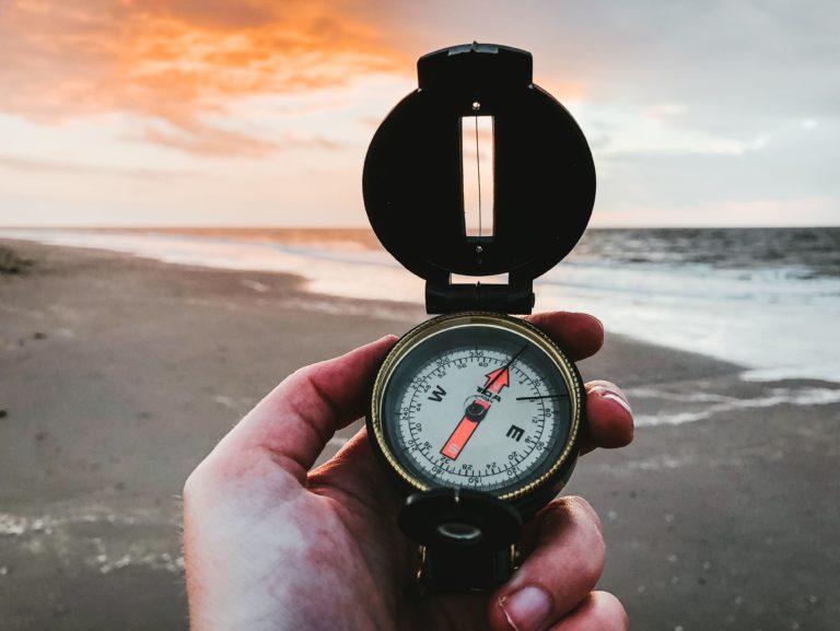 Man holding compass