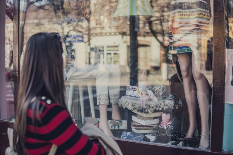 Woman looking at shopping window