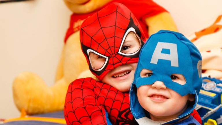 Boys in Spiderman and Captain America costumes.