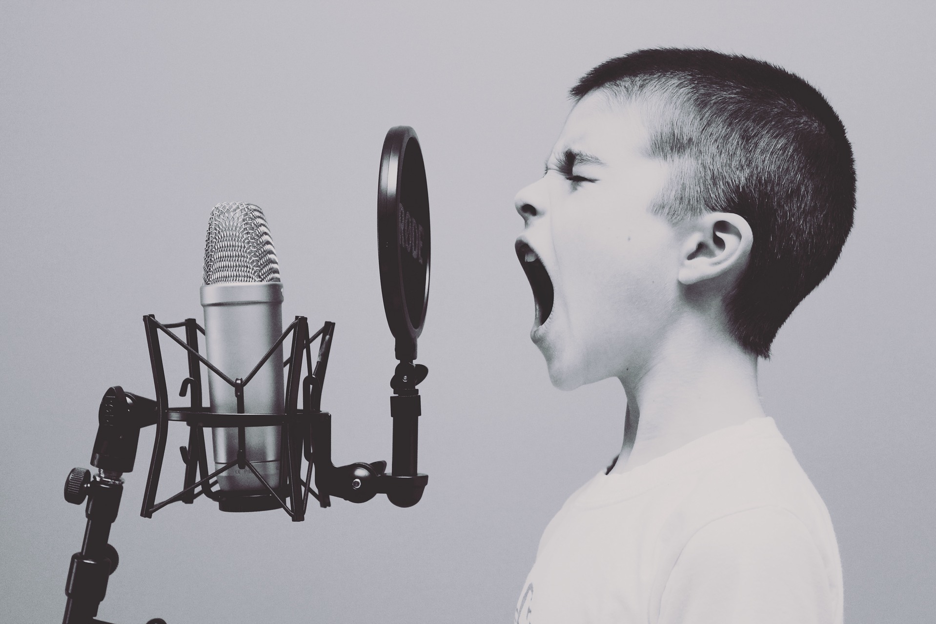 Boy speaking into microphone