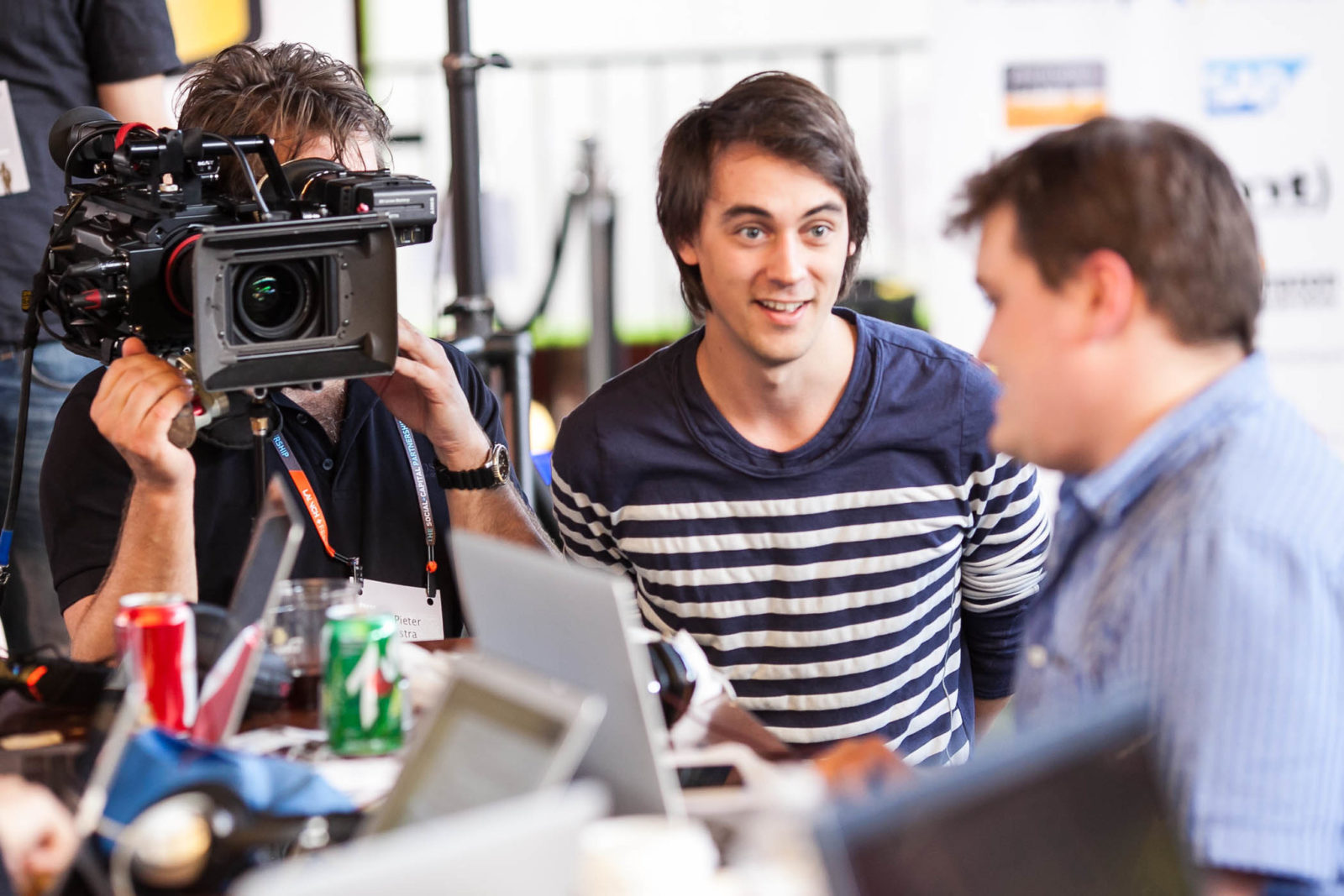 Video production crew in business office.