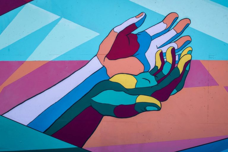mural of hands reaching out