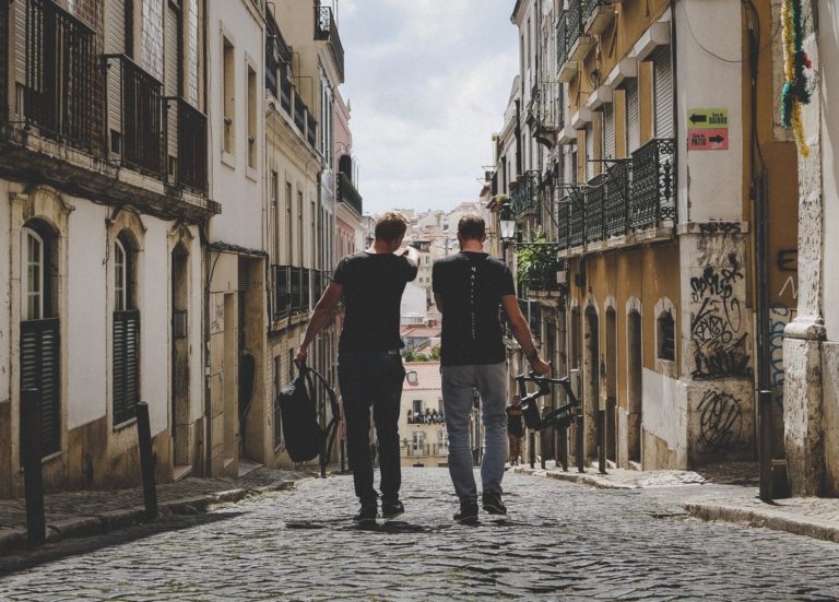 Two men walk down a street to reflect the importance of accurate global content creation depictions.