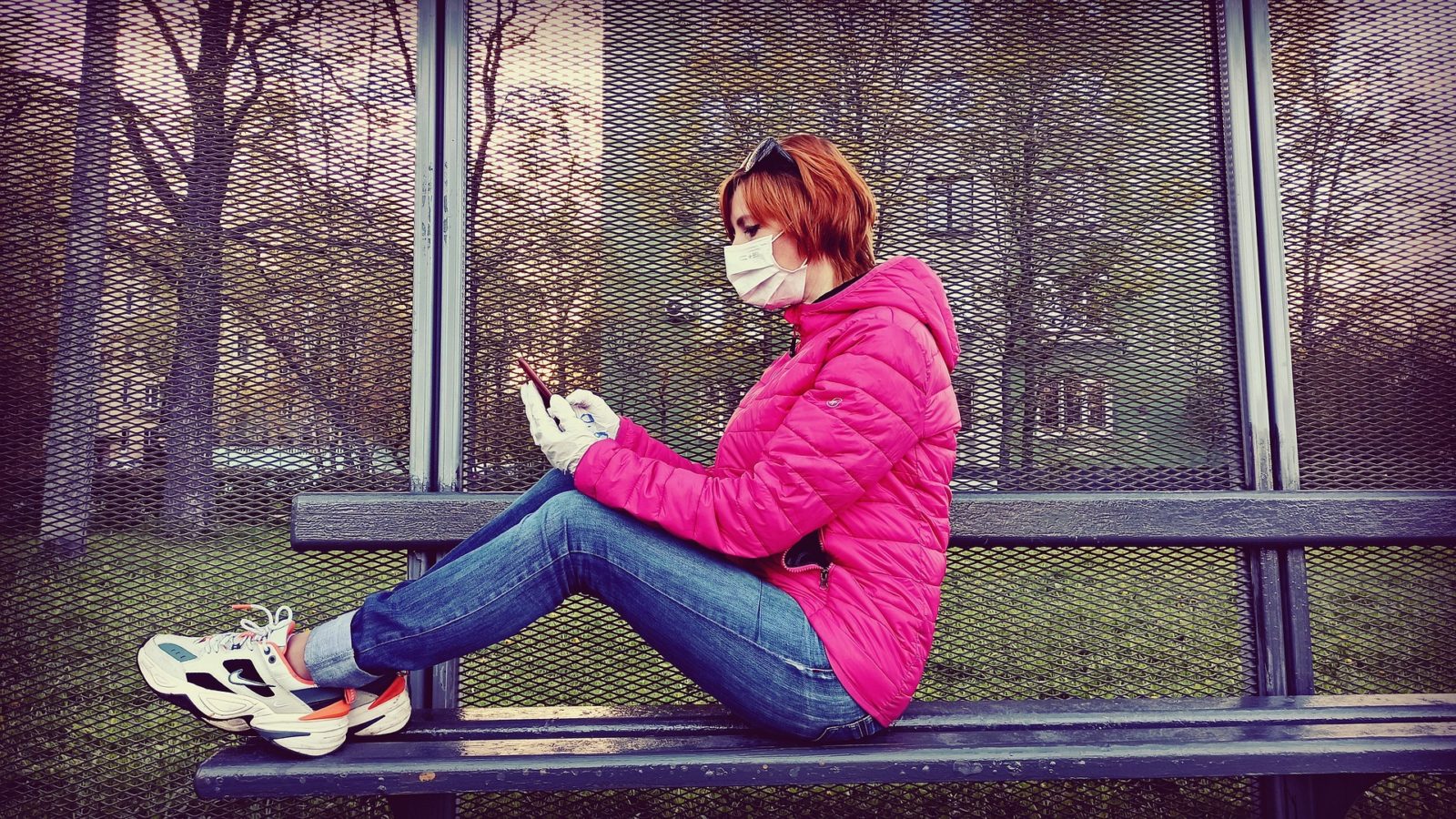 Woman sitting with her phone