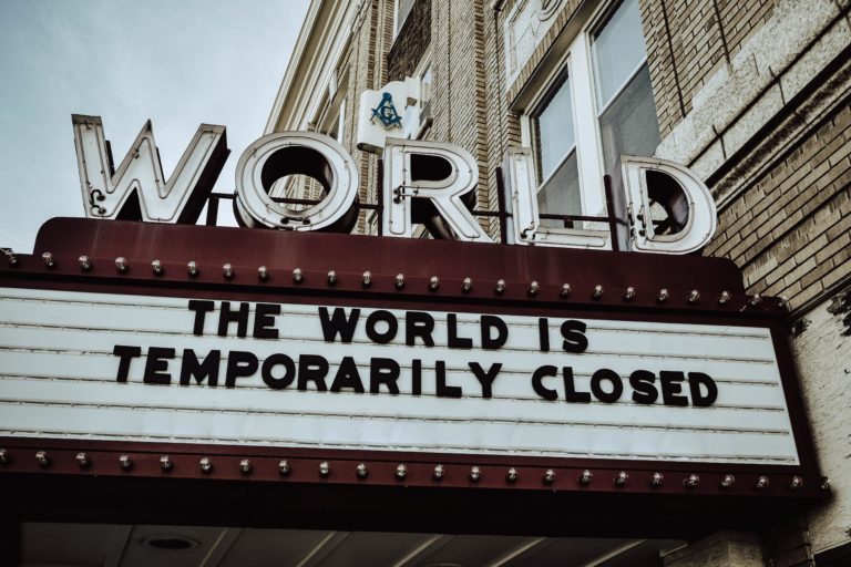 Cinema board announcing "The world is temporarily closed"