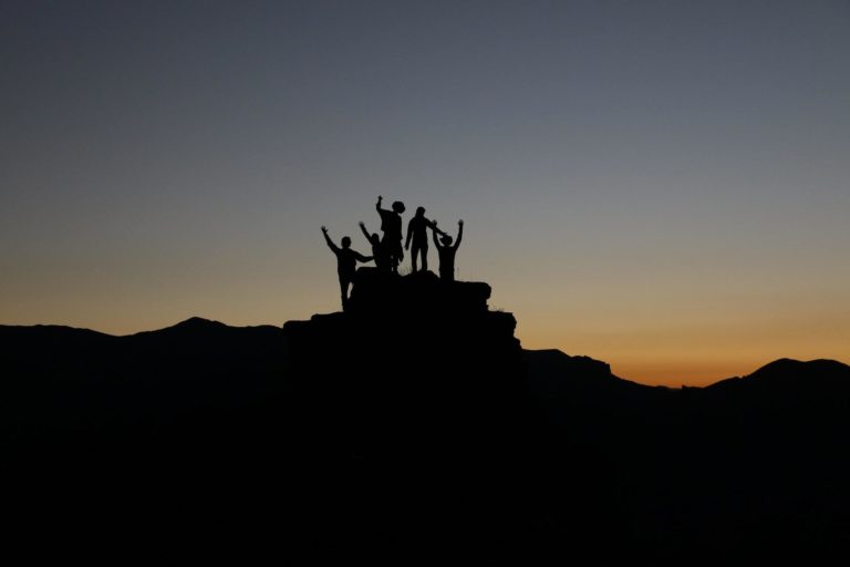 Group at the top of a mountain together
