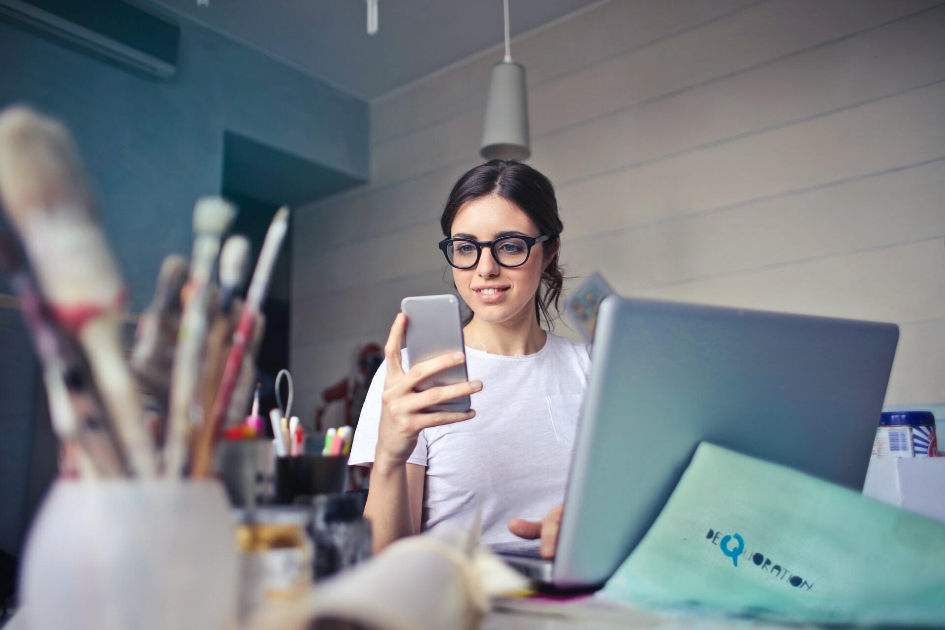 artist looks at her phone